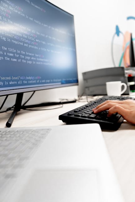 A computer screen displaying HTML code in a code editor, with visible tags such as '<!DOCTYPE html>', '<html>', '<head>', '<title>', and '<body>'. The code appears to be related to website structure a